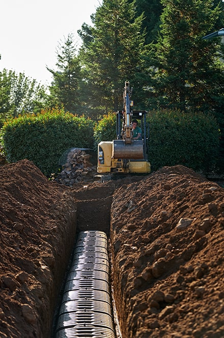 a long leach line in a freshly dug dirt trench